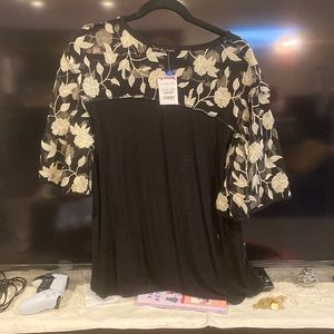 Black top with gold floral detailing